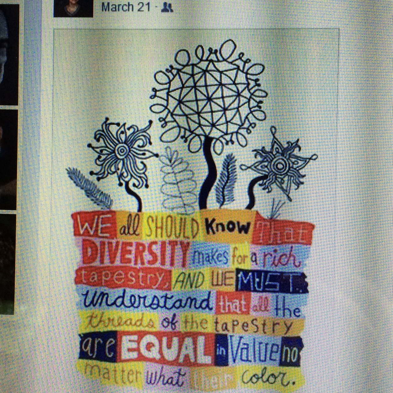Embroidered diversity message with tree, birds, and flowers in colorful thread on fabric