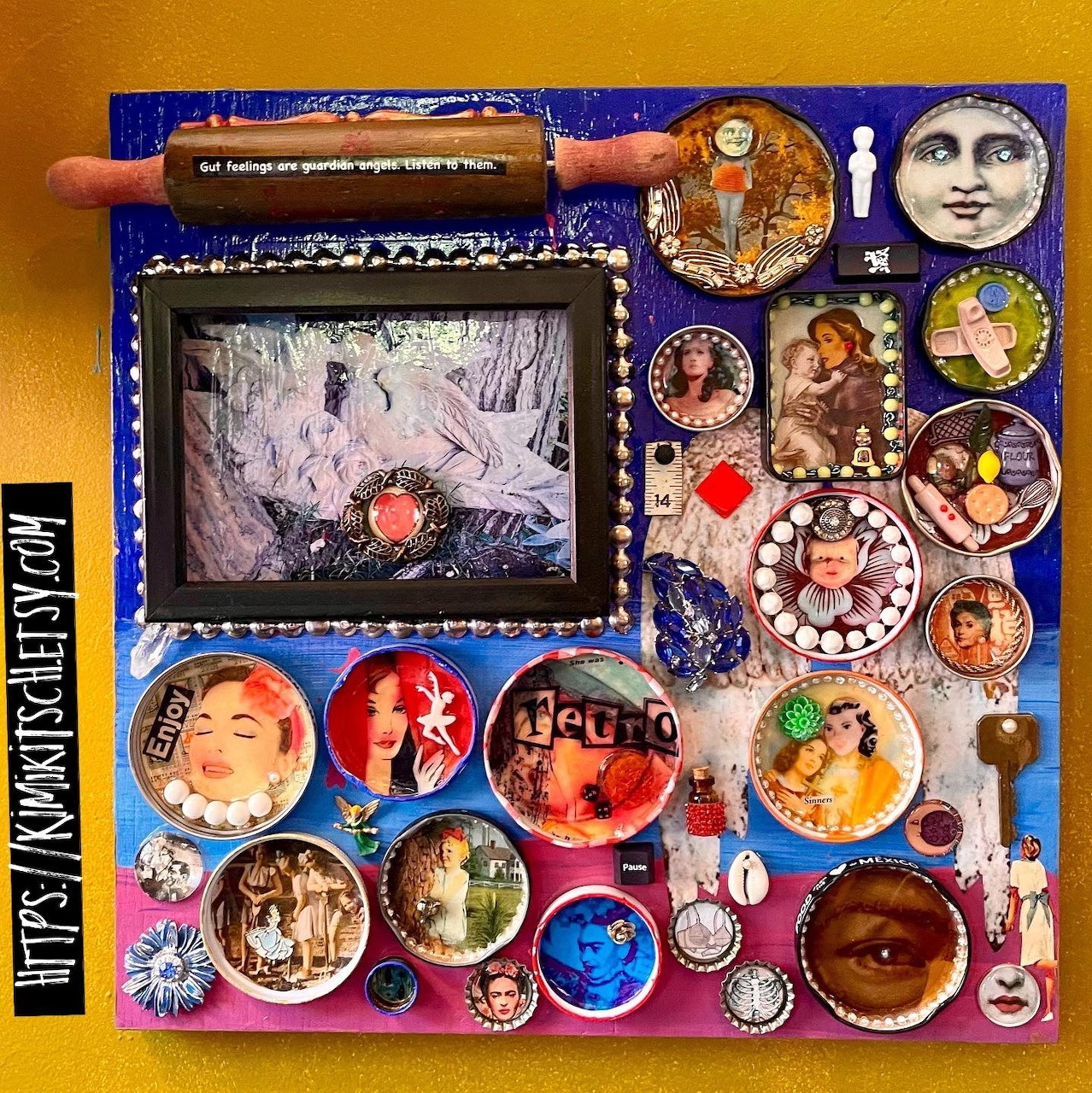 Flat lay of art supplies: palette, brushes, portrait images, and framed art on colorful surface