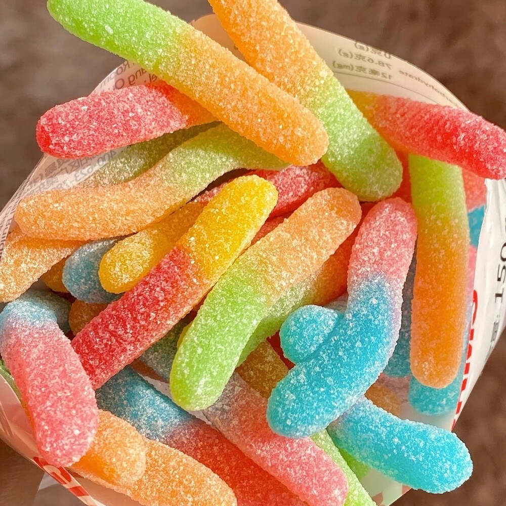 Close-up of colorful sugar-coated gummy candies in a bowl