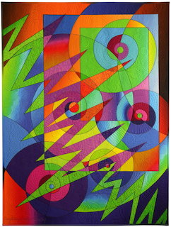 Colorful abstract quilt art with geometric shapes, circles, and zigzag patterns