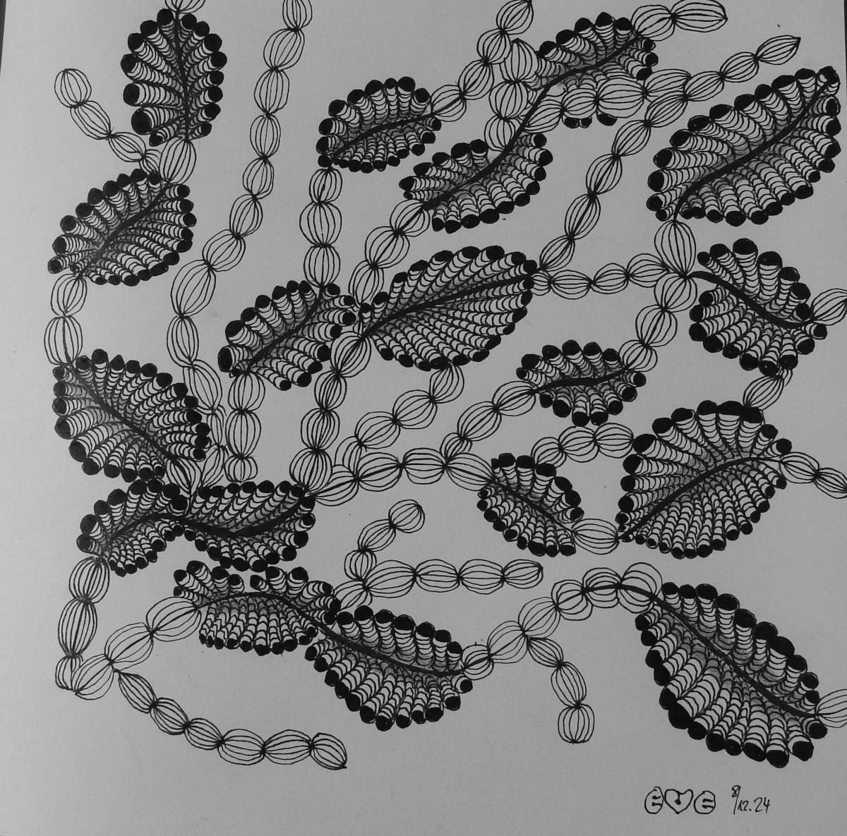 Black lace-style leaves and looping lines forming a monochrome decorative pattern