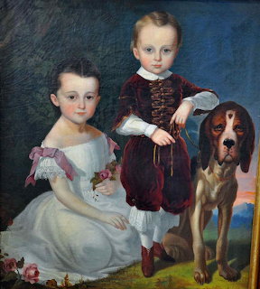 Folk art painting of two Victorian-era children and a beagle dog on blue background
