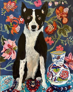 Black and white dog sitting among vibrant folk art flowers and decorated vase on blue patterned background