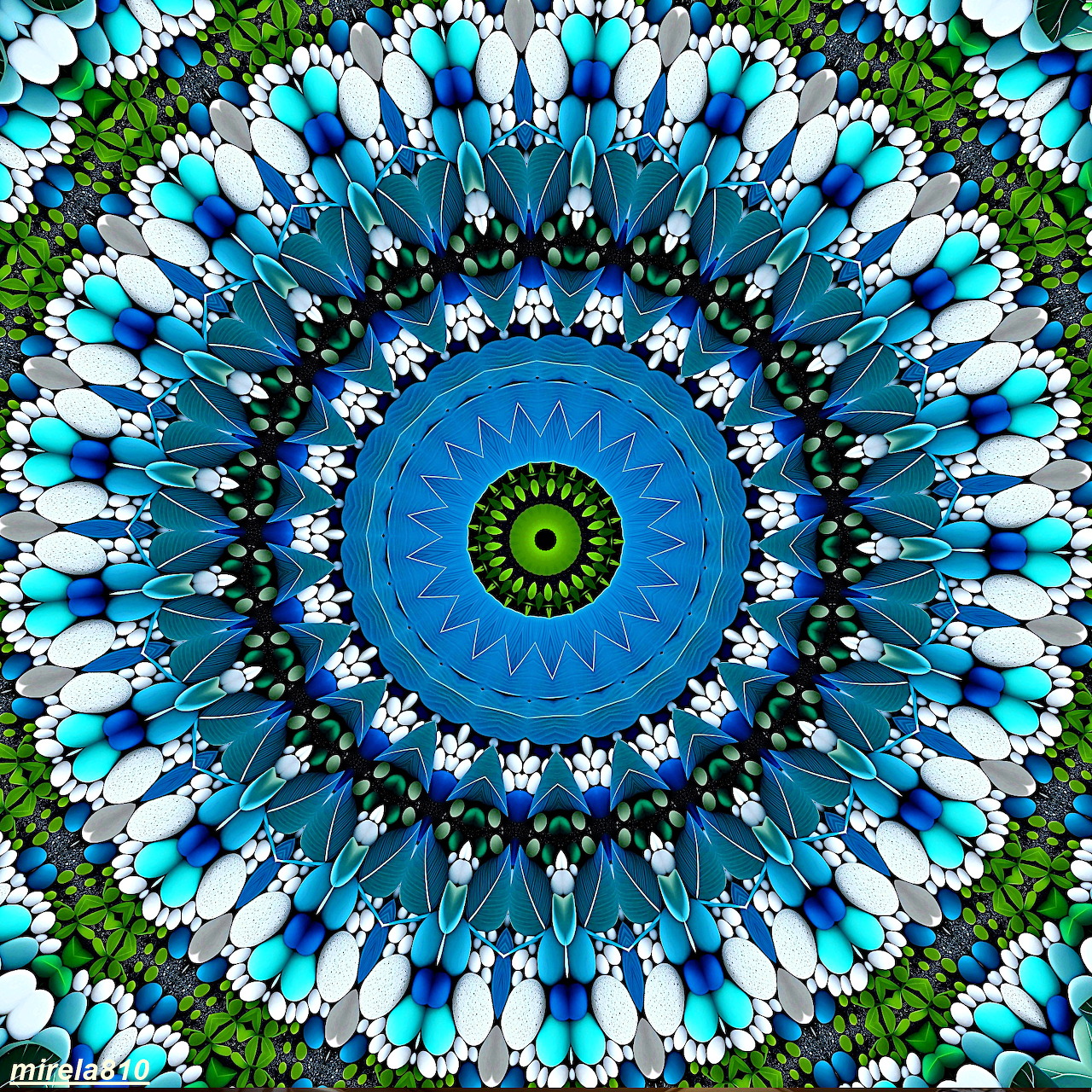 Symmetrical mandala with blue, green, and white floral patterns radiating from a yellow center on a dark blue background