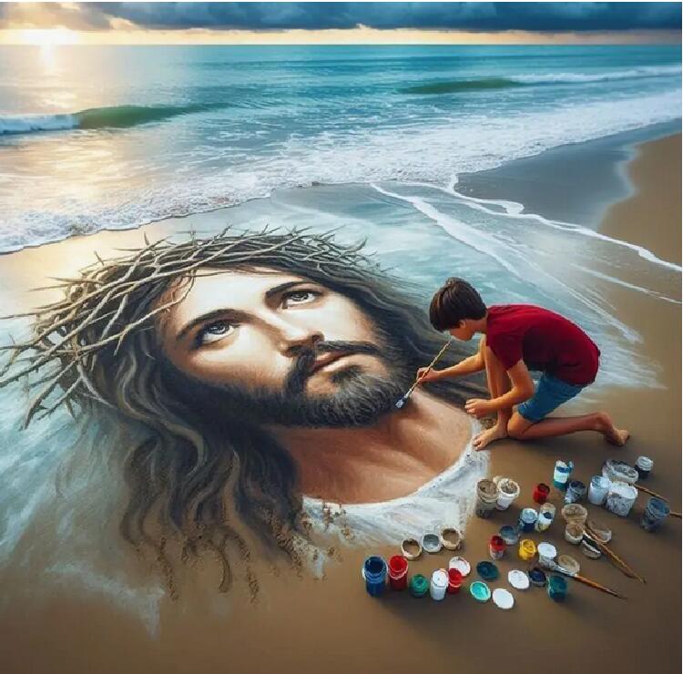Artist painting large Jesus portrait in sand on beach with ocean in background