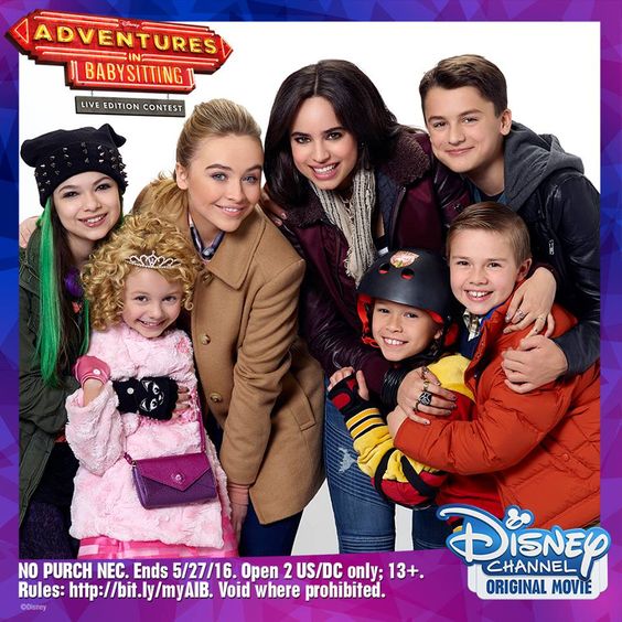Six cast members from Adventures in Babysitting posing together in a promotional photo