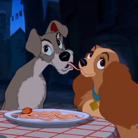 Lady and the Tramp sharing spaghetti in a classic Disney animated scene