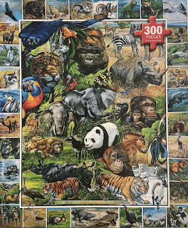 Colorful collage of wild animals including big cats, primates, birds, and endangered species arranged in a dense composite