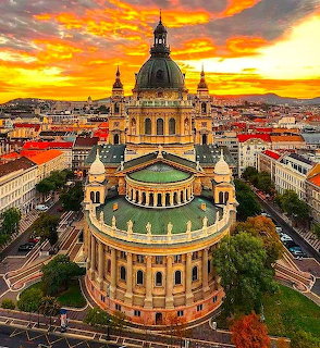 St. Stephen's Basilica in Budapest at sunset with vibrant orange sky