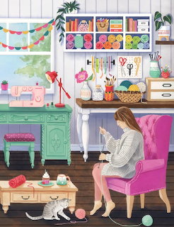 Woman crafting in bright room with pink chair, yarn, sewing supplies, and colorful storage shelves
