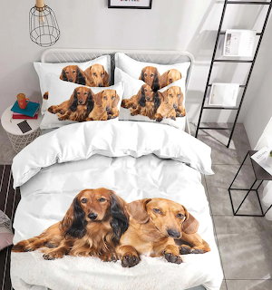 White bed with dachshund dog printed duvet cover and matching pillows in a modern bedroom