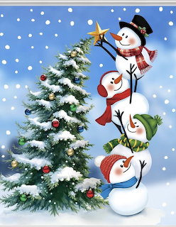 Three stacked snowmen wearing hats and scarves next to a decorated Christmas tree in falling snow
