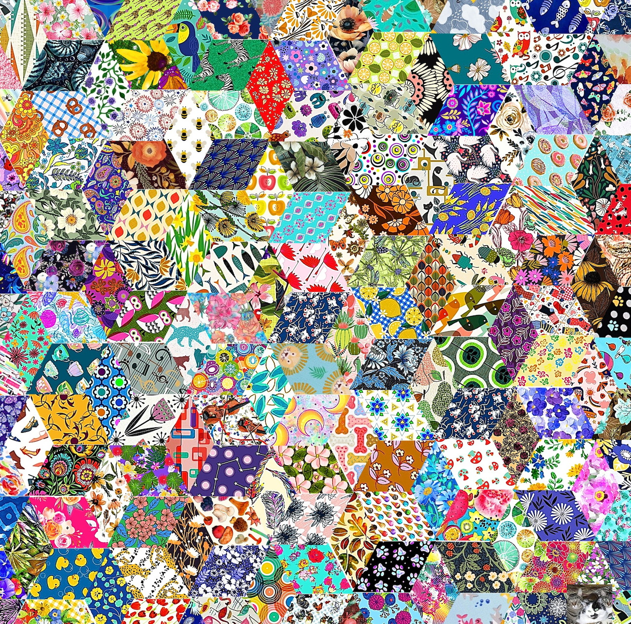 Dense mosaic of colorful hexagonal fabric patches with varied floral, geometric, and abstract patterns