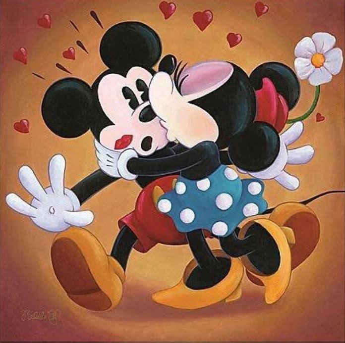 Mickey Mouse and Minnie Mouse hugging with hearts on an orange background