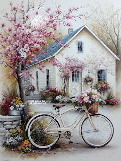 White bicycle with flower basket in front of a white cottage with pink cherry blossom trees
