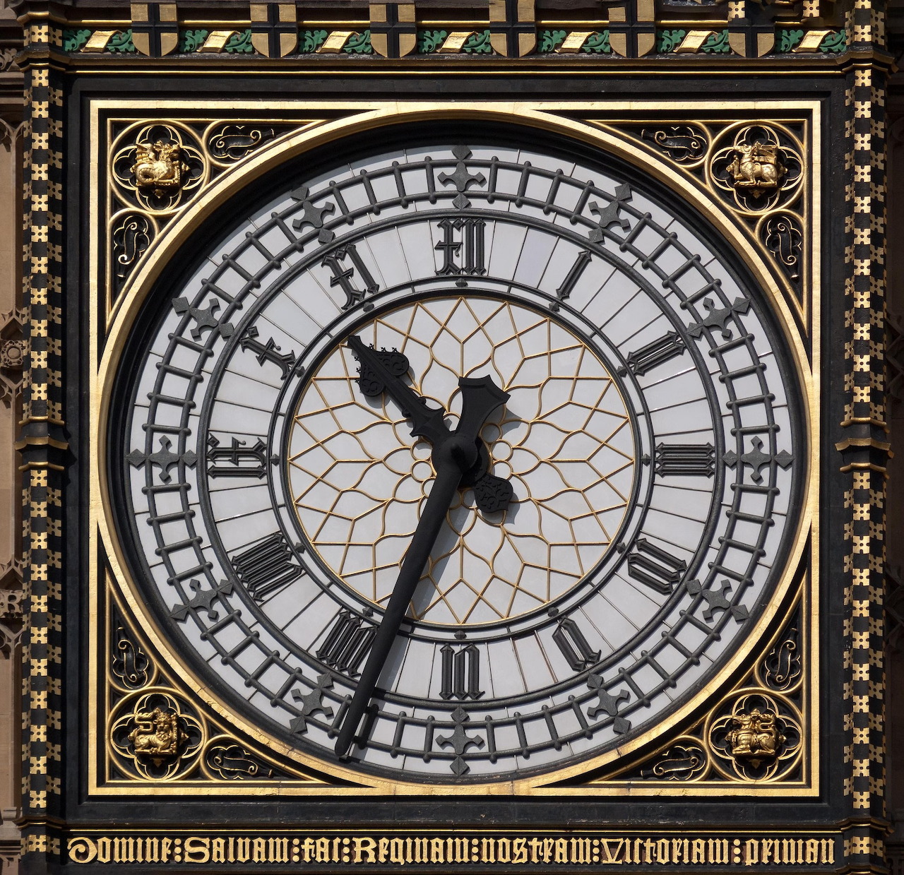 Ornate Victorian clock face with Roman numerals and black hands showing approximately 10:10