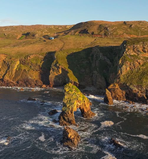 Sea arch and rocky cliffs at Crohy Head on the Donegal coast in Ireland