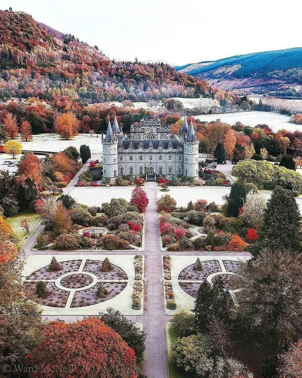 Aerial view of Inveraray Castle with formal gardens and autumn landscape in Scotland
