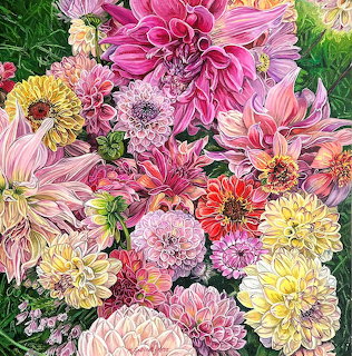Colorful dahlia and chrysanthemum flowers in pink, yellow, and coral shades arranged together with green leaves