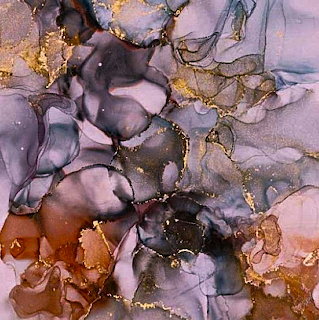 Abstract alcohol ink art in purple and gold with flowing organic patterns