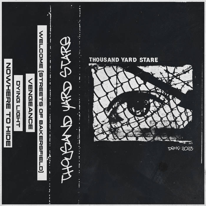Cassette tape cover with fragmented eye mosaic illustration and text reading Thousand Yard Stare on black background