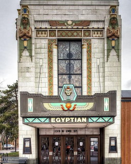 Egyptian Revival style theater entrance with decorative marquee and ornamental facade