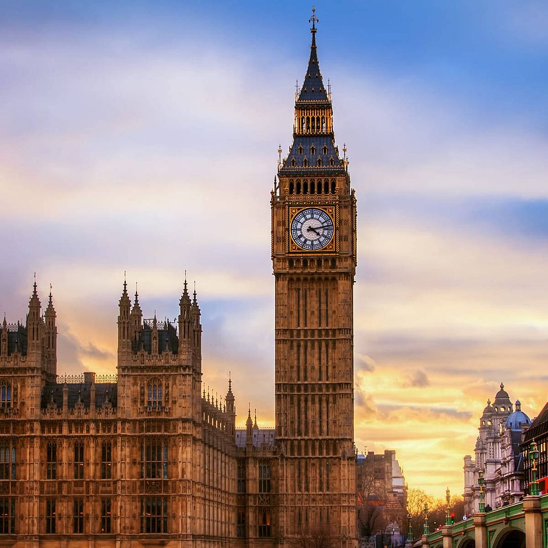 Big Ben and Houses of Parliament in London at sunset with colorful clouds
