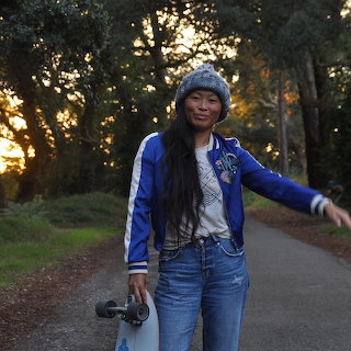 Woman Skateboarding at Sunset
