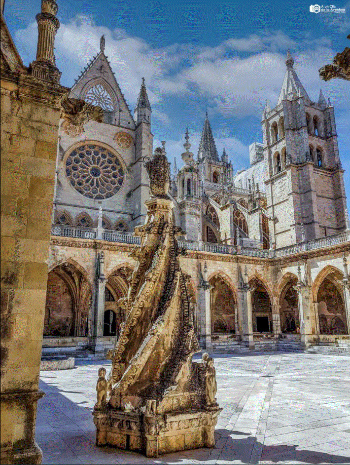 Gothic Cathedral of León, Spain, with stone sculpture, rose window, and twin towers under blue sky