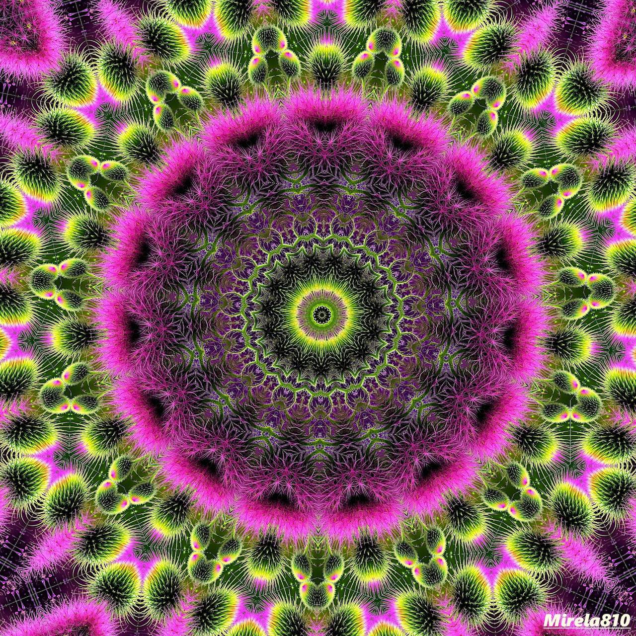 Vibrant circular mandala with magenta, yellow and green symmetrical patterns radiating from center