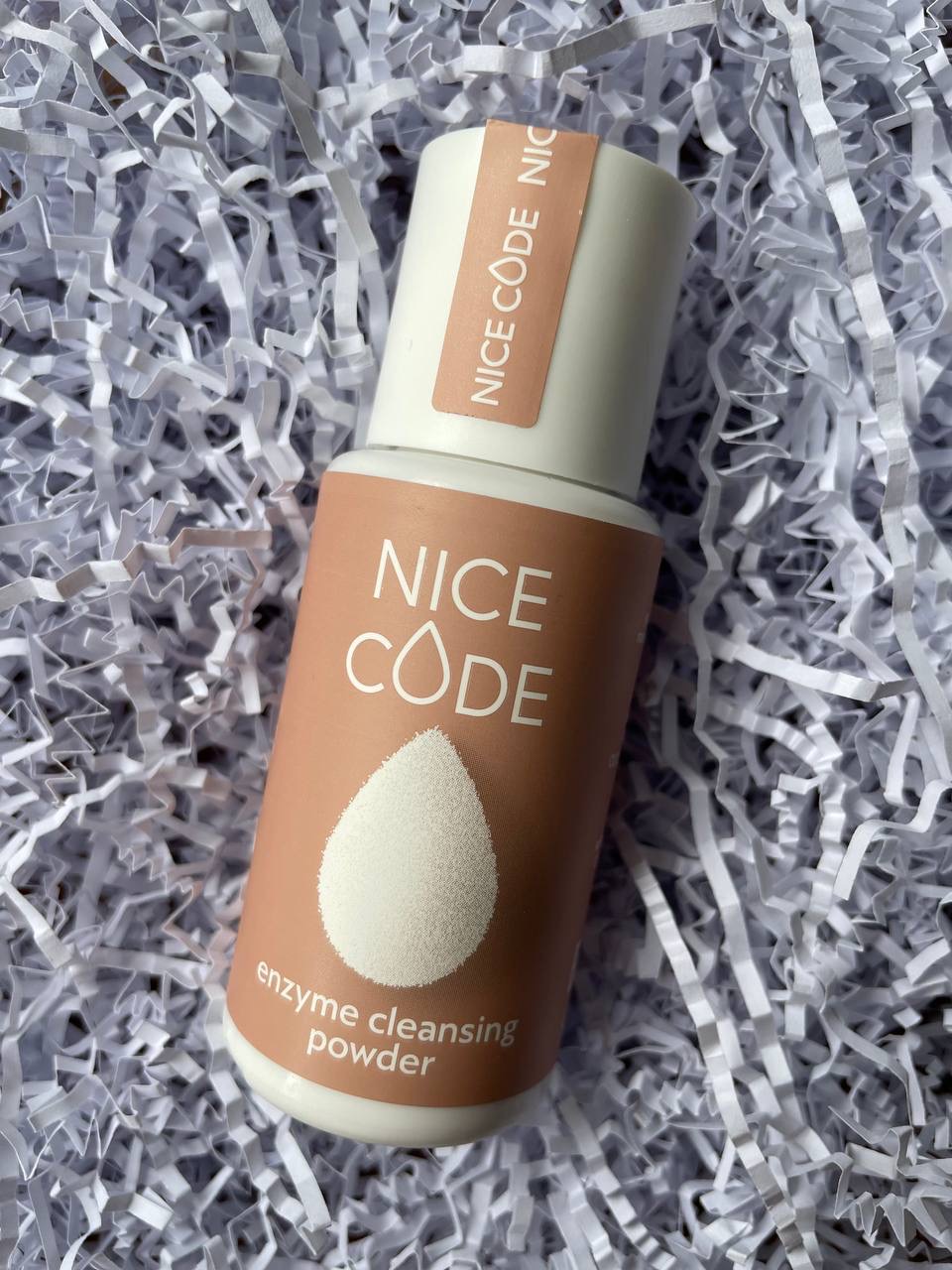Nice Code enzyme cleansing powder bottle with sponge on white shredded paper
