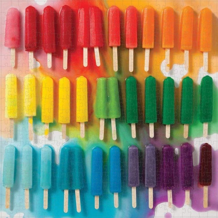 Rows of rainbow-colored popsicles arranged in gradient order from pink through red, orange, yellow, green, blue to purple