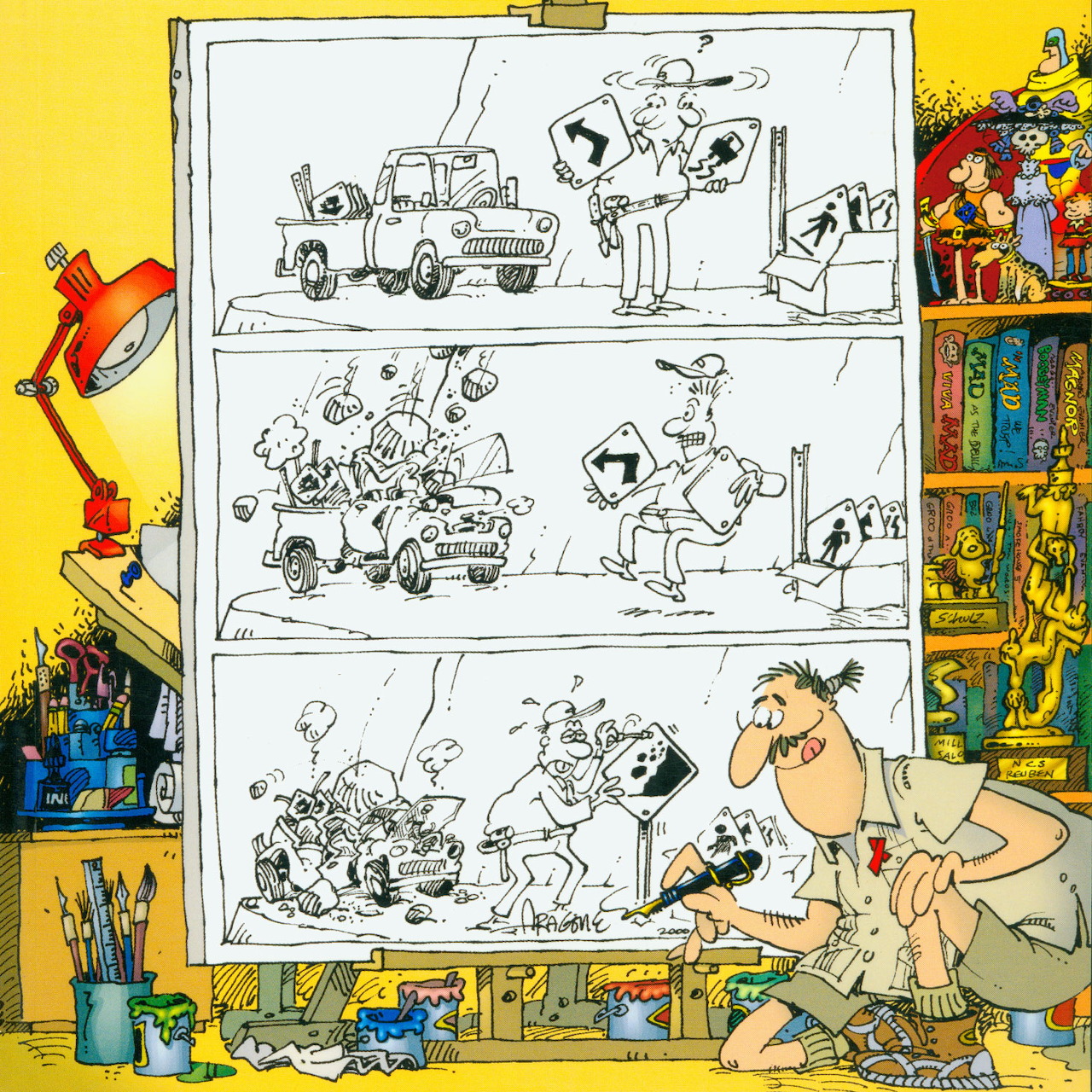 Cartoonist beside a large comic storyboard in a messy art studio