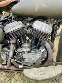 Vintage Harley-Davidson WL V-twin motorcycle engine with cooling fins and green fuel tank
