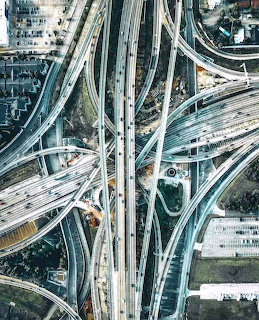 Aerial photo of a massive multi-level highway interchange with curving ramps and overpasses