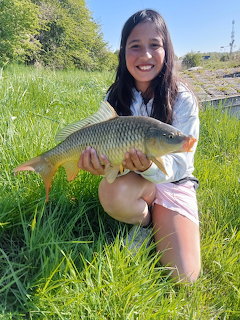 Girl Holding Caughtarp Fish