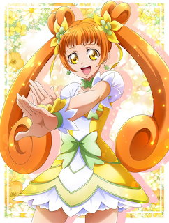 Anime girl with orange twin-tails in white dress with yellow accents, framed by ornate orange swirls and floral border