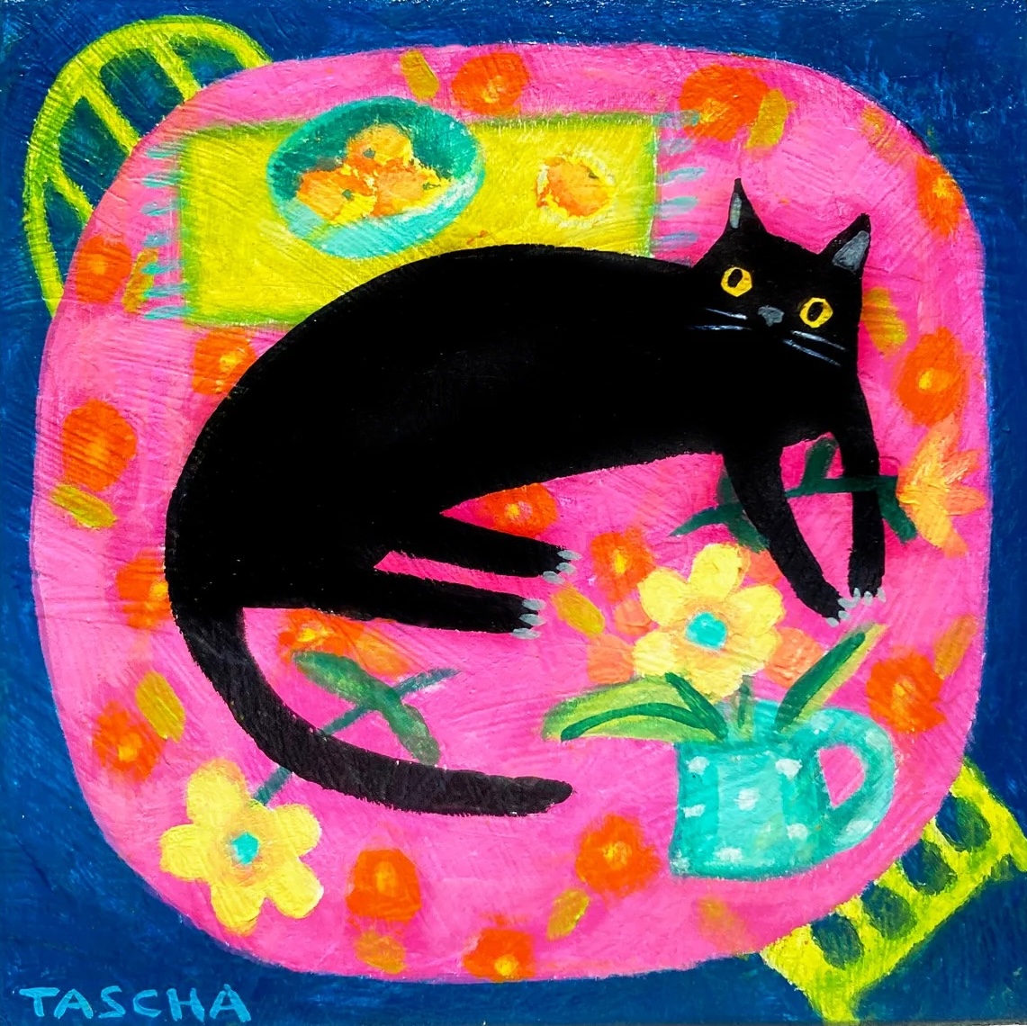 Black cat lying on pink table with colorful flowers and fruit in whimsical painted room