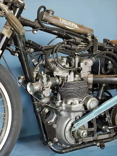 Vintage Triumph motorcycle engine with reversed cylinder head design, chrome components and mechanical details
