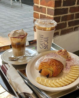 Interior of Ouvert Seoul cafe with coffee and pastry display