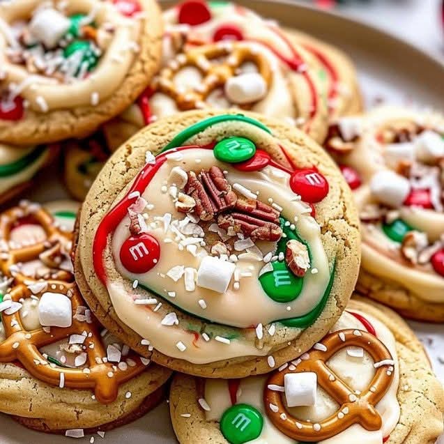 Decorated Christmas sugar cookies with candy toppings and chocolate drizzle