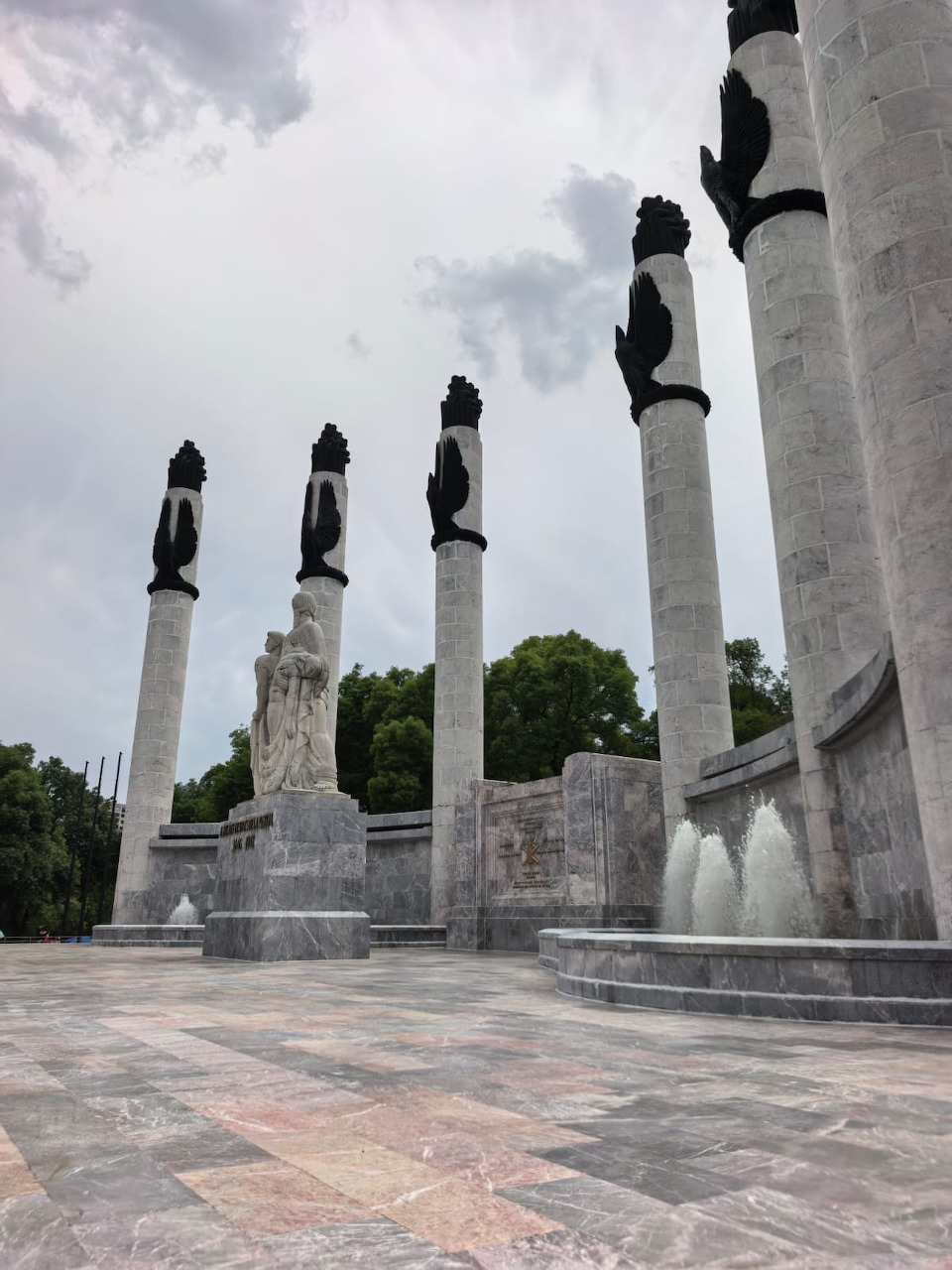 Niños Héroes monument with marble columns and sculptures in Mexico City