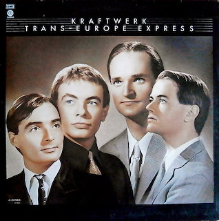 Kraftwerk Trans-Europe Express album cover showing four band members in formal attire