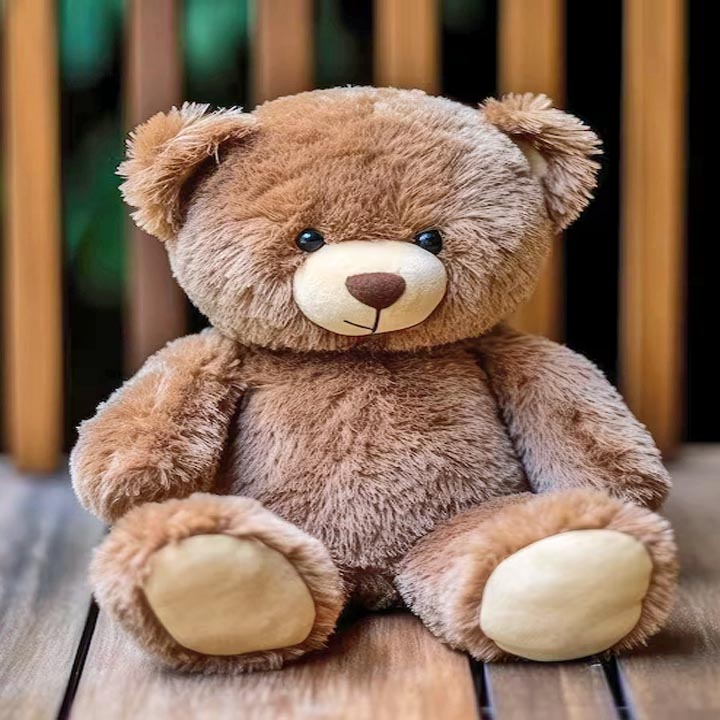 Brown teddy bear sitting on a wooden table with a blurred background