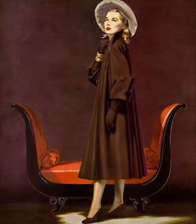 Vintage 1947 fashion illustration of a woman in a brown coat and white hat beside a red chaise lounge