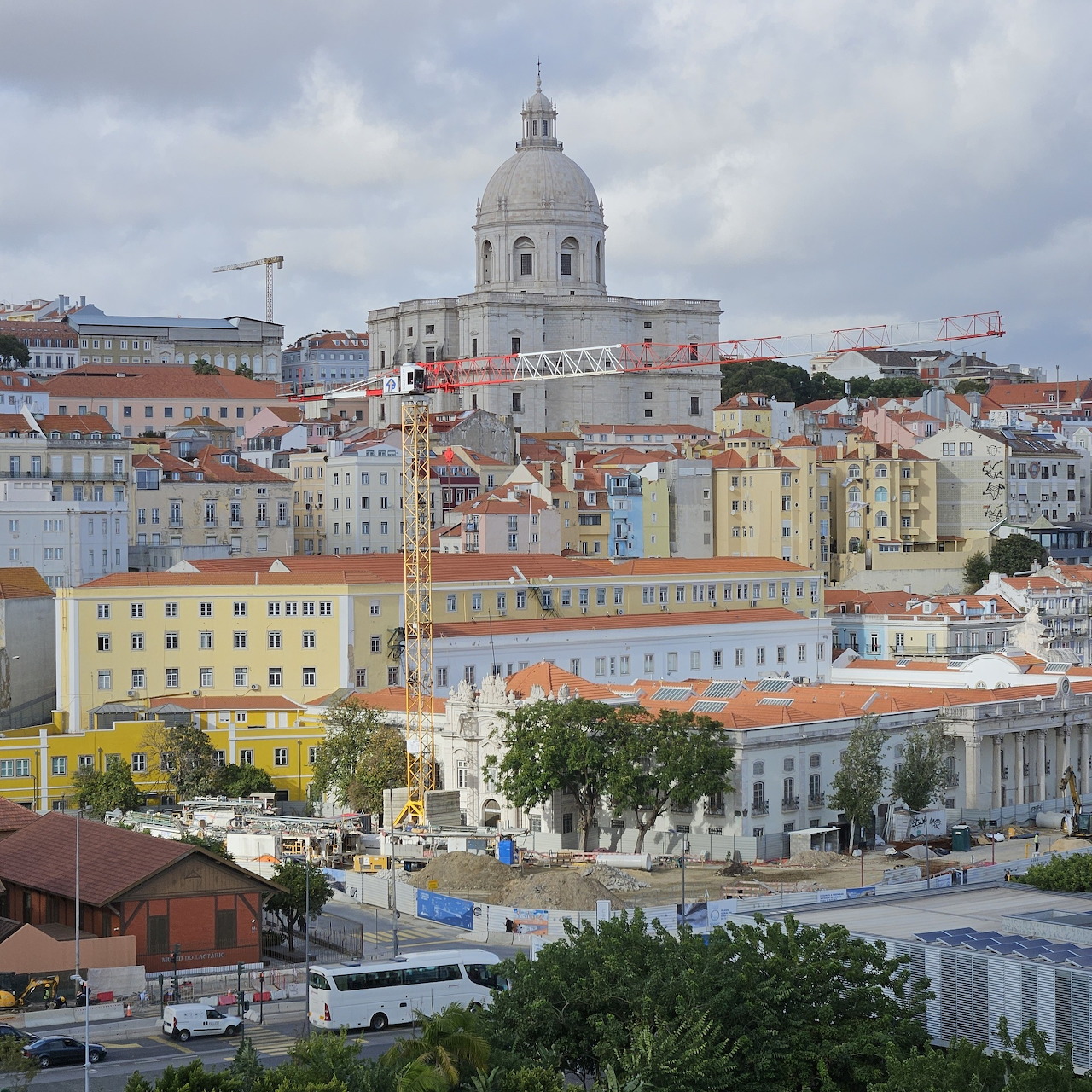 Aerial view of Lisbon showing the National Pantheon and pastel-colored buildings along the waterfront