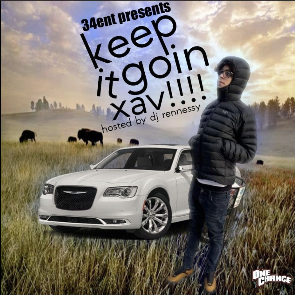 Person in black jacket standing next to white luxury car in field with cattle at sunset