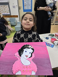 Girl Showing Snow White Painting