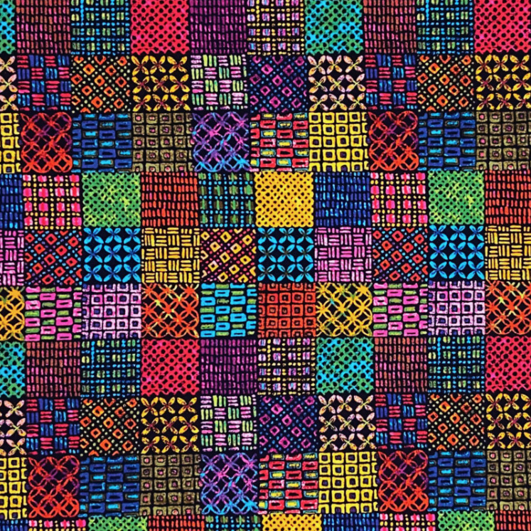 Colorful patchwork quilt with geometric patterns in varied fabrics arranged in a grid layout