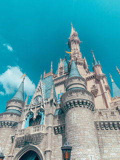 Cinderella Castle at Disney Magic Kingdom with pink turrets under blue sky